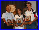 Col Chang presenting the Junior Pistol Team Trophy Plaques to the TSRA Jr Gold Team (Rebekah Jennings & John Seward)